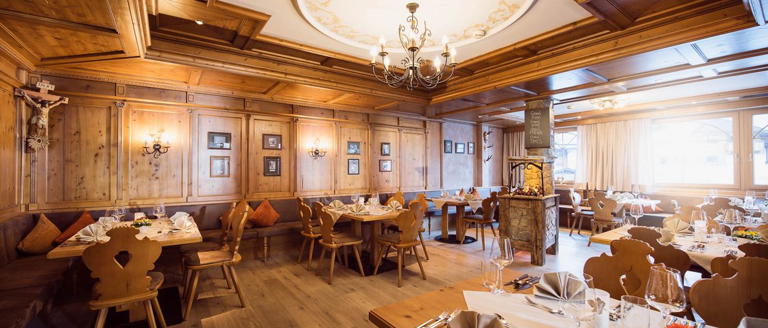 The secret to an indulgent holiday Traditional restaurant with wooden furniture and set tables